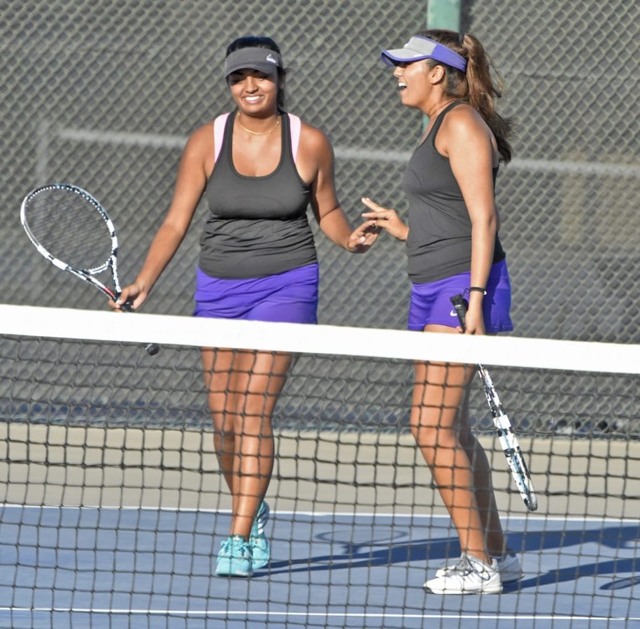 Valencia Doubles team Ahenti Bommireddipalli, left, and Vashvi Mongia celebrate during their match against San Marino at Valencia on Monday. Signal photo by Dan Watson.