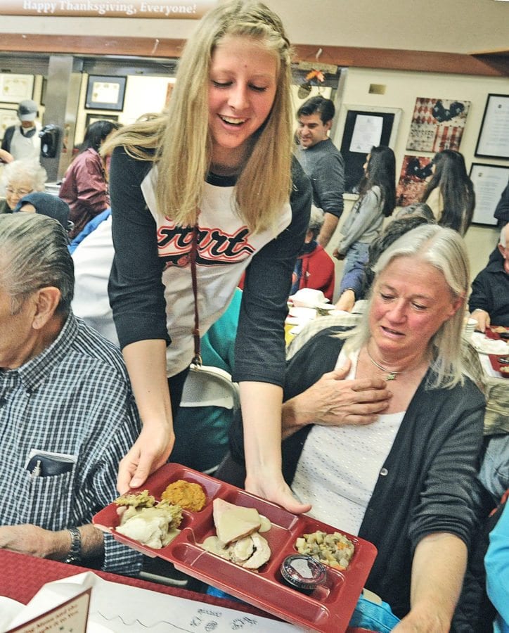 Signal File Photo: Hart High School student Aspen Sorenson serves seniors at the Santa Clarita Valley Senior Center during last year's Thanksgiving feast, hosted by the Castaic Lions Club, the William S. Hart Union High School District and the SCV Senior Center in Newhall on Thursday. Dan Watson/the Signal