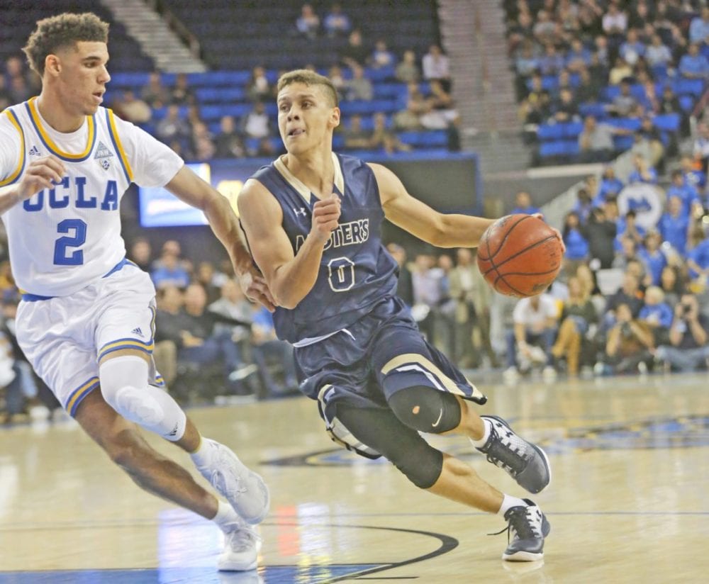 The Master’s University’s Hansel Atencia (0) drives toward the basket as UCLA’s Lonzo Ball (2) keeps up during an exhibition game at Pauley Pavilion in Los Angeles on Nov. 1. Katharine Lotze/Signal