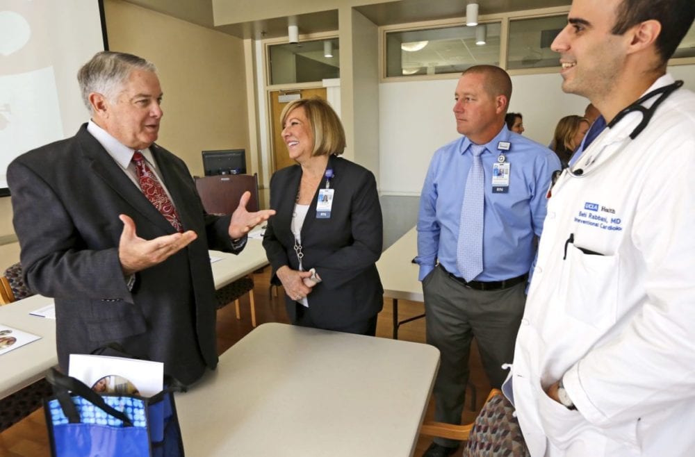 College of the Canyons womens basketball coach Greg Herrick, left, talks with Henry Mayo Hospital's Jean Marie Stewart, center, Dustin Ashenfelter, right, and Dr. Behi Rabbani, far right, on Tuesday about the day in September first responders, nurses, and doctors helped save Herrick from a heart attack. Katharine Lotze/Signal