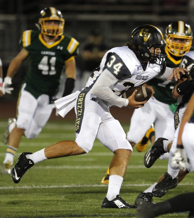 Golden Valley's Ray Ibrahim (34) tries to dodge the Canyon defense during at game at Canyon on Oct. 21. Katharine Lotze/Signal