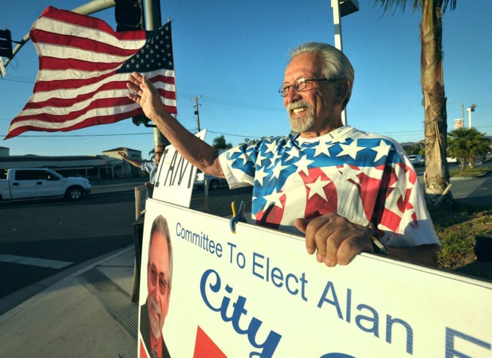 Alan Ferdman waves to motorists as he campigns at the corner of Bouquet Canyon Road and Soledad Canyon Road. Dan Watson/the Signal