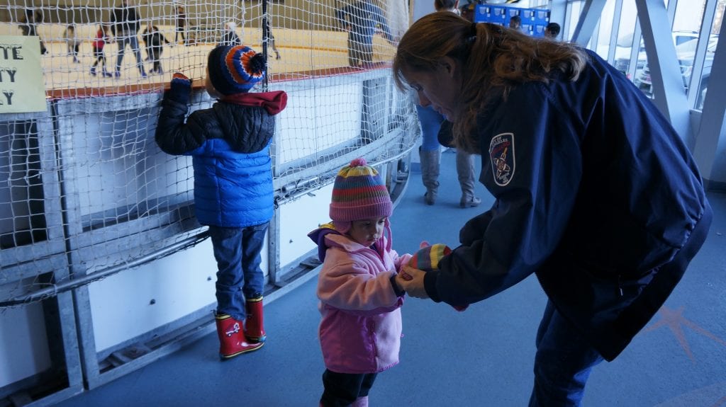 Jennifer Plummer, right, fixes Kayin Plummer's, her daughter's, jacket before heading out on the Ice at the Valencia Ice Station's Family Snow Day on Sunday. Samie Gebers/ The Signal