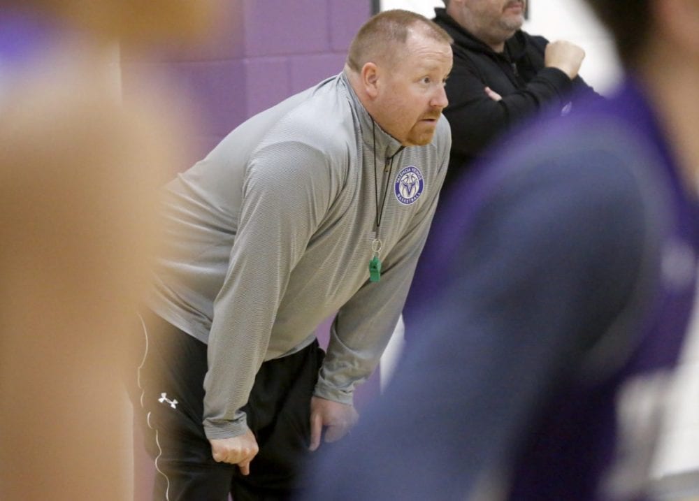 Valencia boys varsity basketball coach Chad Phillips watches his team run drills at Monday's practice. Katharine Lotze/Signal