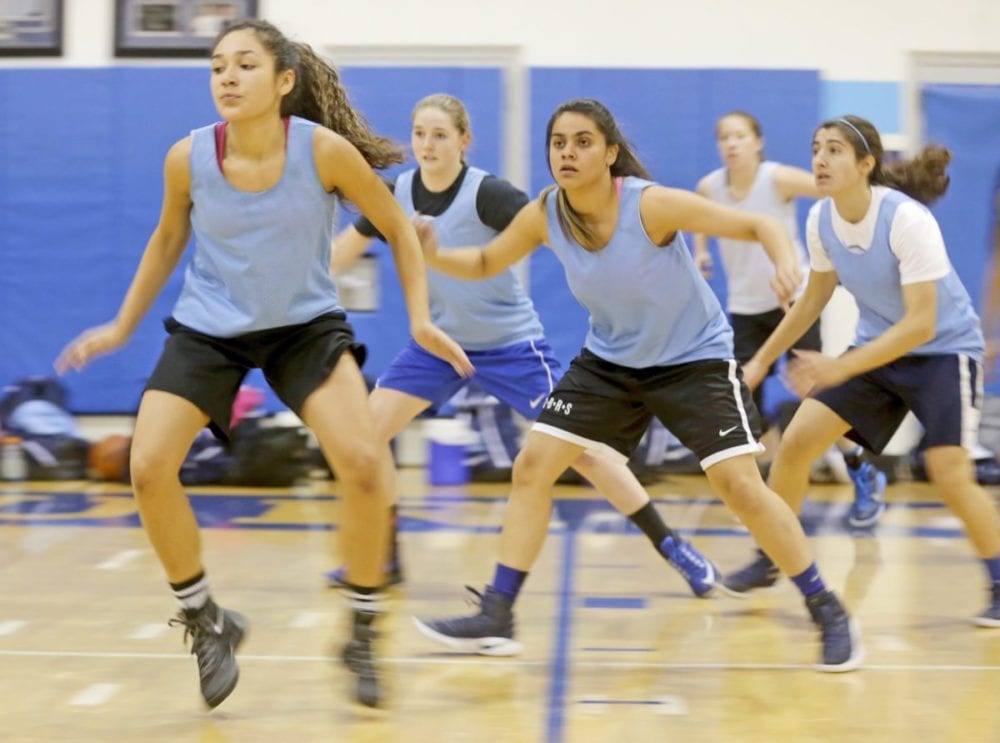 The Saugus girls varsity basketball team runs drills during a practice on Nov. 29. Katharine Lotze/Signal