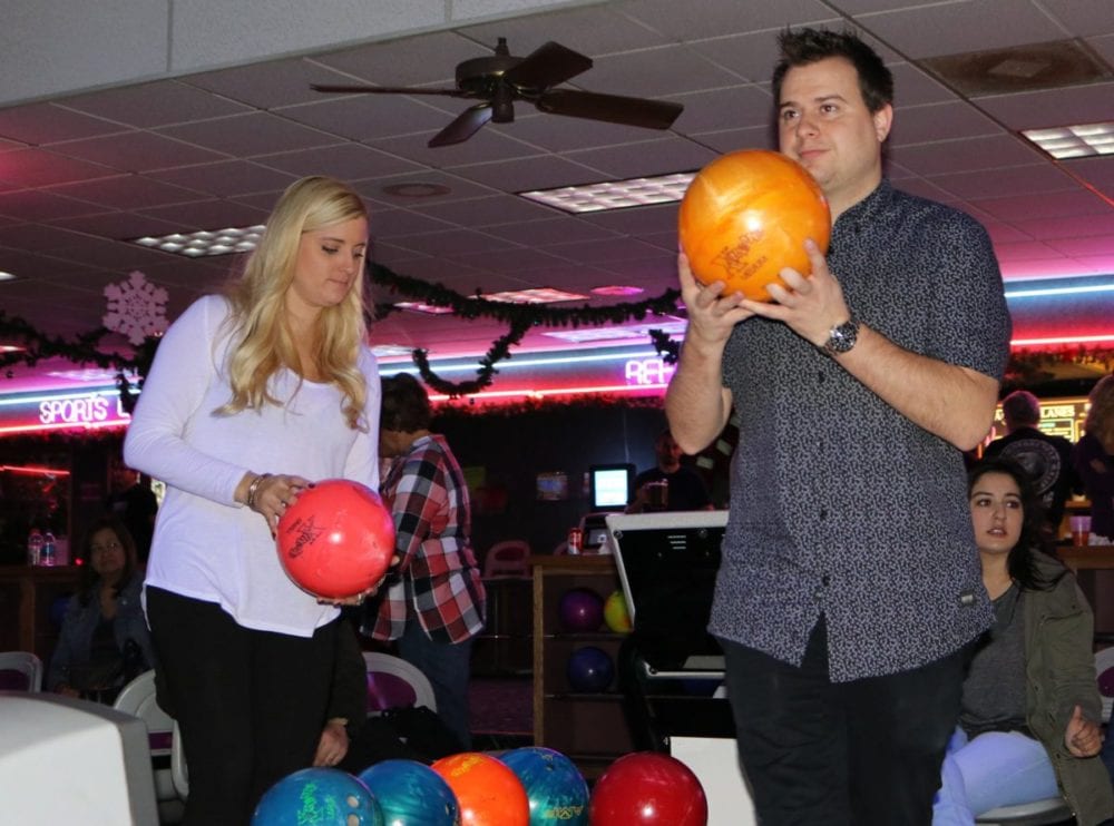 Sydney Goldrick, left, and Cameron Cole participate in Bowling for Kids at Valencia Lanes on Sunday, Dec. 4, 2016. Nikolas Samuels/The Signal