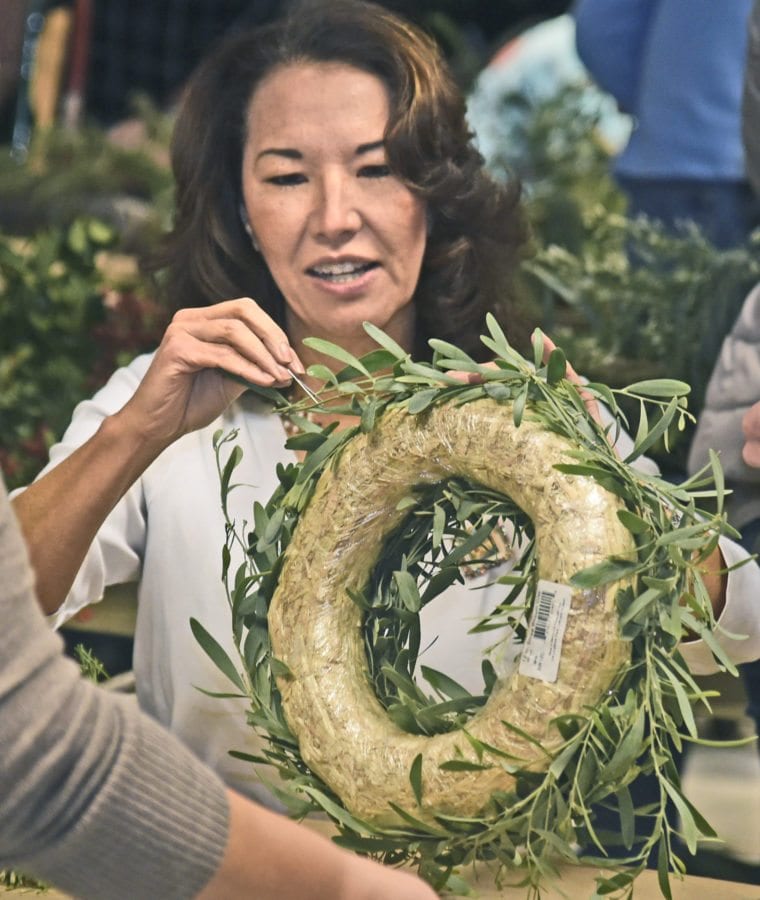 Lynda Davidson of Auga Dulce decorates her wreath at the annual Holiday Craft Fair on Saturday which has been held at the Placerita Canyon Nature Center for more than 35 years in Newhall. Dan Watson/The Signal