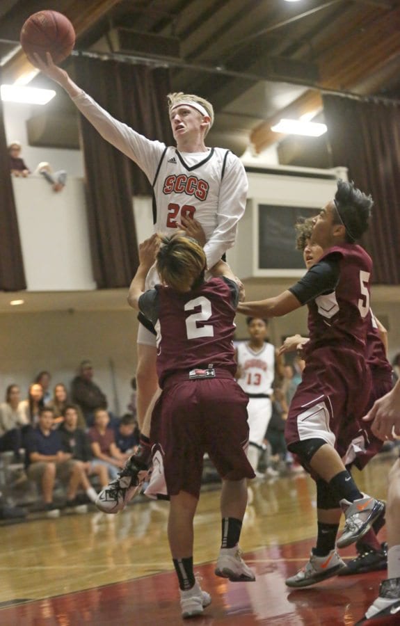 Santa Clarita Christian's AJ Caldwell (20) goes in for a layup against Albert Einstein Academy on Thursday. Katharine Lotze/Signal