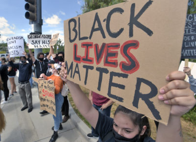 Black Lives Matter protesters hold down street corners, have peaceful resolution with deputies