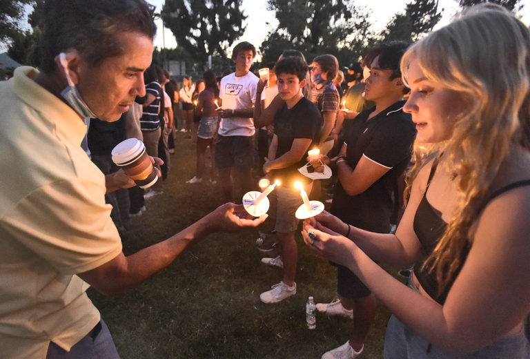 Friends, family hold candlelight vigil in honor of Michael Lodl