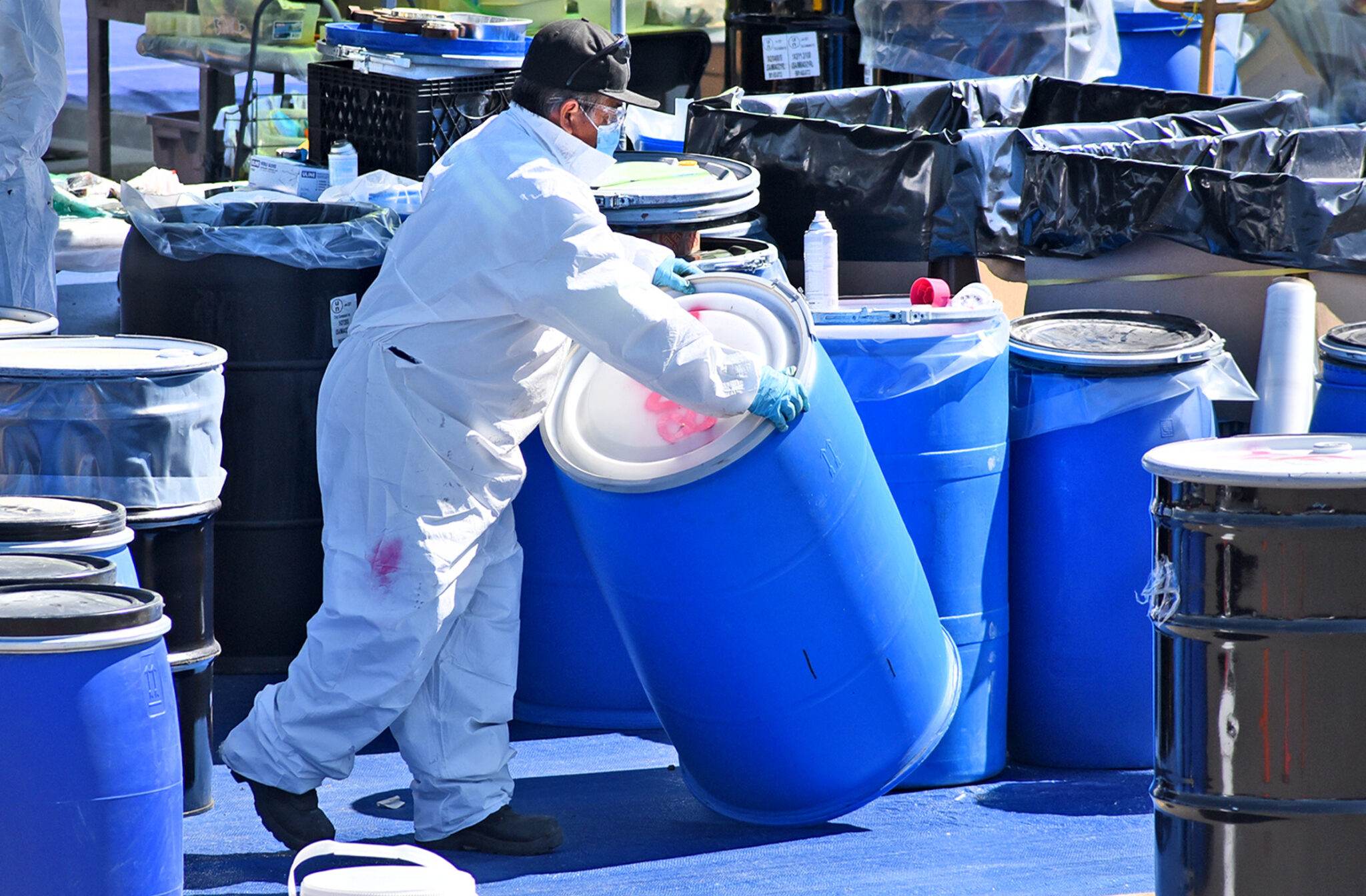 Residents drop off household hazardous waste at drivethru