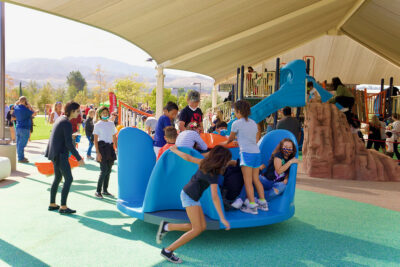 Children on the playground at the new Canyon Country Community Center during the official opening day event in October 2021.