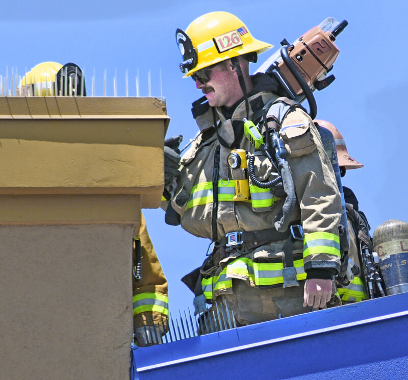 Los Angeles County Firefighters inspect the roof after responding to a fire at Best Buy in Santa Clarita and evacuated the building on Tuesday, 072622.  