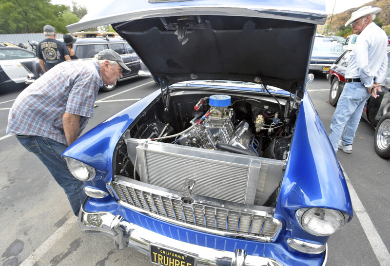 Bob Hauser, left, inspects the engine of a 1955 Chevrolet 210 on display at the Annual Elks Lodge Car and Motorcycle  Show held at Santa Clarita Elks Lodge 2379 in Santa Clarita on Saturday, 091022. 