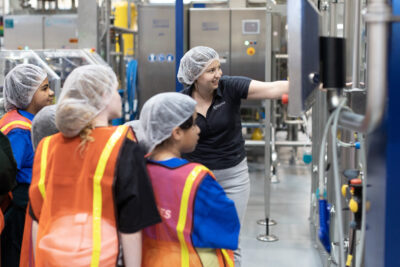 A DrinkPAK employee shows the beverage manufacturer's production operation to members of the Santa Clarita Valley Boys & Girls Club's STEM program. Courtesy photo.