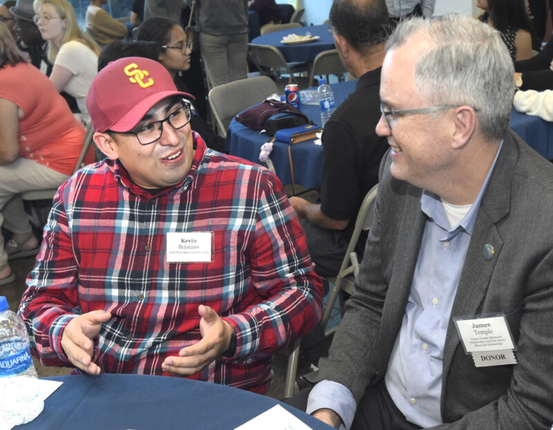 Scholarship recipient Kevin Bejarano, left, and donor, James Temple chat the College of the Canyons Foundation Annual Scholarship Reception held at the Dr. Dianne G. Van Hook University Center on the COC Valencia campus on Thursday, 051123. 