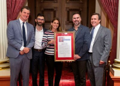 Sen. Scott Wilk (right) presents a Senate resolution to Santa Clarita Valley Chamber of Commerce President and CEO Ivan Volschenk, Board Chair Becki Robb, and Vice President Peter Warda with Sen. Henry Stern (left). Courtesy photo.