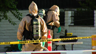 L.A. County officials work in Hazmat suits at the scene of an industrial accident at HASA, a pool supply company in Saugus. Oscar Sol/ For The Signal
