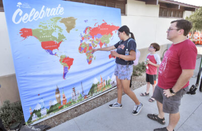 The Shephard Family of Saugus pick out Spain on the world map as they arive at the CELEBRATE:Spain event held at Canyon Country Community Center on Friday, 071423. Dan Watson/The Signal