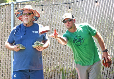 Chris Haslock, left, and Dustin Bowman team up as 28 teams compete for the $500 top prize during the inaugural Samuel Dixon Family Health Center Cornhole Tournament Fundrasier held at Kucky Luke Brewing in Santa Clarita on Saturday, 081223. Dan Watson/The Signal