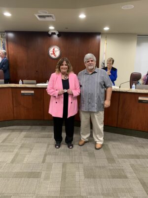 Sue Solomon receives the One Hart Award from Wiliam S. Hart Union High School board member Joe Messina on Wednesday. Courtesy photo Hart district