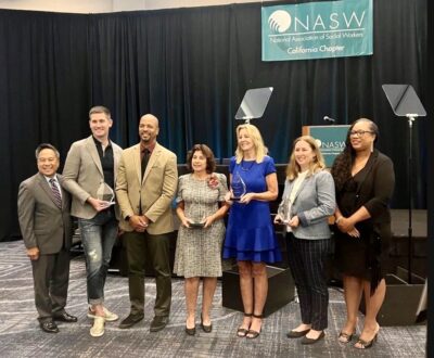 Jaime Piscione, vice president of programs and services, accepting the 2023 Organization of the Year Award, alongside officials from the National Association of Social Workers and recipients of the Social Worker of the Year, Community Member of the Year and Lifetime Achievement Member Award. Courtesy photo.