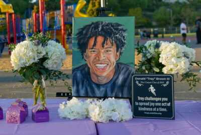 Multiple photos and paintings of Donald Randolph Brown III also known as “Trey” were on display upon arrival at the memorial on Sunday evening. Katherine Quezada/ The Signal