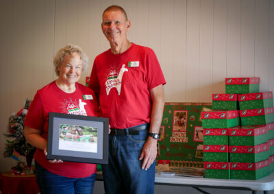 Linda Dodes (left) and Bob Dodes (right) are given a certificate of recognition by The Sanctuary Church during their 11 a.m. service for their dedication to Samaritan's Purse Operation Chirstmas Child on Sunday morning. Katherine Quezada/ The Signal