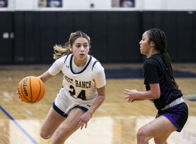 West Ranch guard Alanna Topete (24) dribbles the ball against Valencia point guard Kaydence Johnson (3) during the second quarter of their game at West Ranch in December. Habeba Mostafa/ The Signal