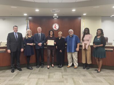 Retired Valencia High School softball coach Donna Lee was recognized by the William S. Hart Union High School district at a recent governing board meeting. Tyler Wainfeld/The Signal.
