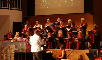 Mission Opera Artistic and Executive Director Josh Wentz directs the ensemble of singers during their “Winter Holidays of the World” concert held at the Santa Clarita United Methodist Church on Friday night. Katherine Quezada / The Signal