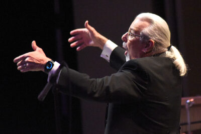 Allan Robert Petker conducts as The Santa Clarita Master Chorale performs "Magnificat" by Taylor Scott Davis with an orchestra on stage during the "Holiday Lights" performance at the Santa Clarita Performing Arts Center in Valencia on Saturday, 120923. Dan Watson/the Signal