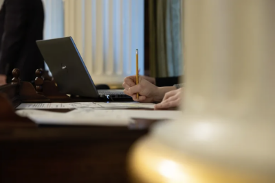 Capitol staffers at work on the Assembly floor on April 24, 2023. Photo by Miguel Gutierrez Jr., CalMatters