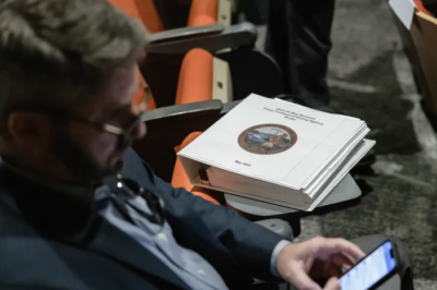 A binder for Gov. Gavin Newsom’s revised budget proposal for 2023-24 during a press briefing at the state Natural Resources Agency in Sacramento on May 12, 2023. Photo by Rahul Lal, CalMatters