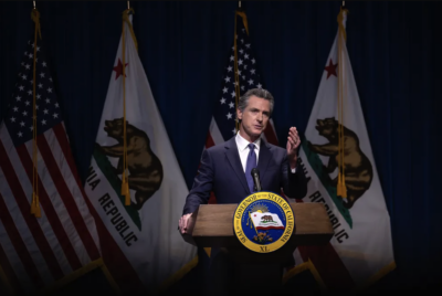 Gov. Gavin Newsom addresses the media during a press conference unveiling his 2024-25 January budget proposal at the Secretary of State Auditorium in Sacramento on Wednesday. Photo by Miguel Gutierrez Jr., CalMatters