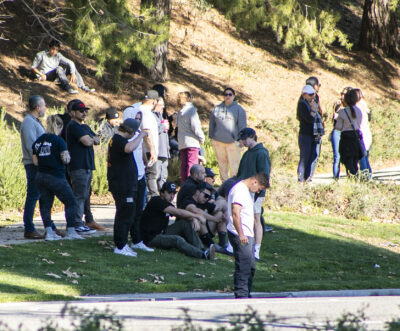 Loved ones gather to mourn the victim of Thursday night's crash on Valencia Boulevard Friday afternoon. Habeba Mostafa/ The Signal