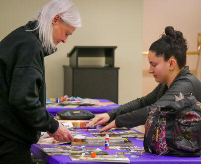 Participants of the vision board activity quietly focused to intently create their vision board for 2024 at the Valencia Library on Saturday afternoon. Katherine Quezada/ The Signal
