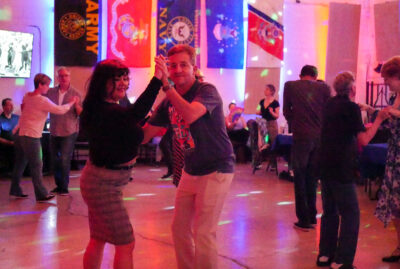 Attendees dance to music performed by Flattop Tom & His Jump Cats at the first anniversary party for Club 507 in American Legion Post 507. Katherine Quezada/The Signal