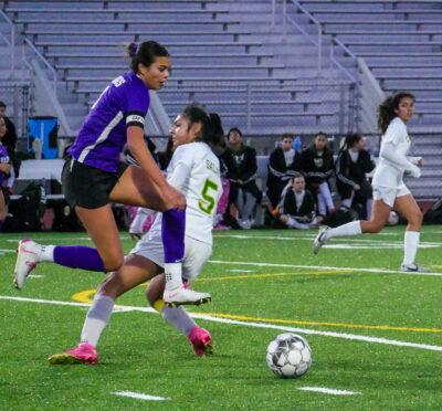 Sofie Rooney (10) from Valencia leaps past Canyon's Siena Salas (5) during Thursday evening’s game at Valencia High School. Katherine Quezada/The Signal