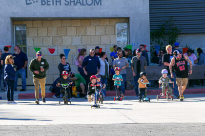 CBS Preschool students raced down the pathway in their tricycles and scooters on Sunday morning during their 26-year-old annual F.U.D.G.E Day event. Katherine Quezada/ The Signal