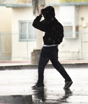 Valencia High School students wait for their rides as heavy rain falls in Valencia on Tuesday, 020624. Dan Watson/The Signal
