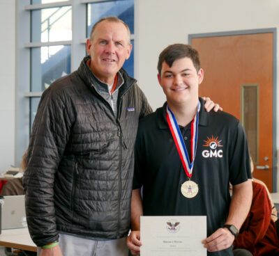 Castaic High School Principal Vince Ferry poses with Broden Weeks after he receives his medal and certificate for being selected as a recipient of the gold-level President's Volunteer Service Award during the staff’s faculty meeting on Friday morning. Katherine Quezada/The Signal