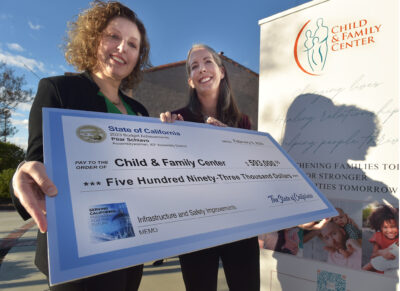 Assemblywoman Pilar Schiavo, left, presents a check for infrastructure and safety improvements to Nikki Buckstead, CEO of the Child & Family Center in Santa Clarita on Friday, 020924. Dan Watson/The Signal