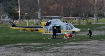 L.A. County Fire Department rescue personnel prepared to airlift an 8-month-old girl from Central Park after the child suffered a medical emergency on Tuesday in Saugus and was transported to the park by ambulance. Photo by Joel Rosario/For The Signal