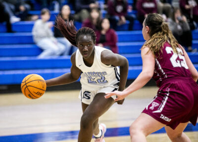 Saugus center Destiny Onovo (22) dribbles the ball against Torrance's Bella Roosa (25) during the third quarter of the CIF quarterfinals at Saugus High School on Wednesday, Feb. 14. Habeba Mostafa/ The Signal