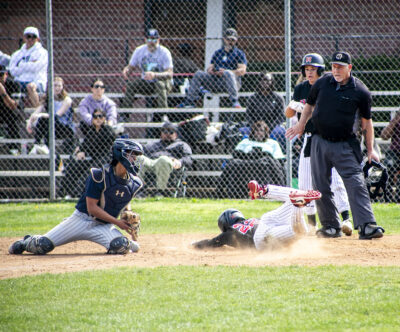 Hart infielder Matthew Perez (22) slides into home plate during the fourth inning of Saturday's game against Sierra Canyon on Feb. 24. Habeba Mostafa/ The Signal