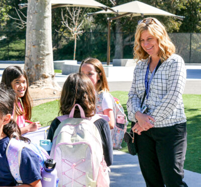 Charles Helmers Elementary School Principal Michelle Velikorodnyy checks in with students at the end of their break before going back to class to continue their studies on Thursday. Katherine Quezada/The Signal