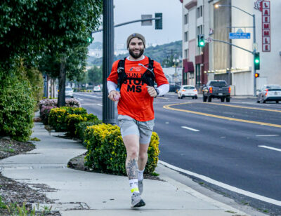 Michael Azar from Denville, New Jersey runs through Newhall at 7 a.m. Thursday on his way to Barstow for his 164 mile run for Multiple Sclerosis. 21 runners stretching 3,260 miles across America are scheduled to participate in the ultra relay event hosted by MS Run the U.S.Katherine Quezada/The Signal