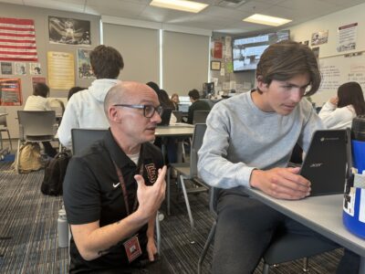 Castaic High School teacher David Williams helps 10th-grade AP world history student Ezekiel Andrew with an assignment during a recent class session. Tyler Wainfeld/The Signal.