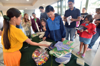 Fifth-grade author Ruby Jiang, 11, left, signs her books for a fundraiser held at the Pico Canyon Elementary School open house event on Thursday, 050224. Dan Watson/The Signal